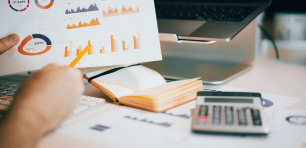 Convert PDF to Word – documents and a laptop on a desk