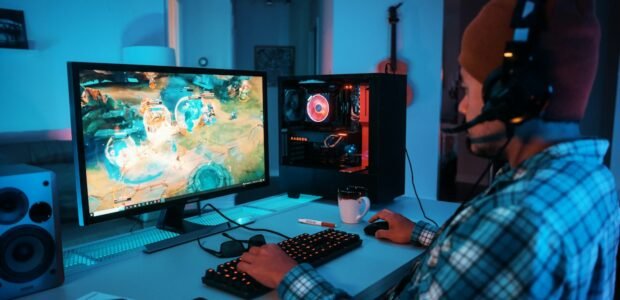 Gamer wearing a headset at a PC setup