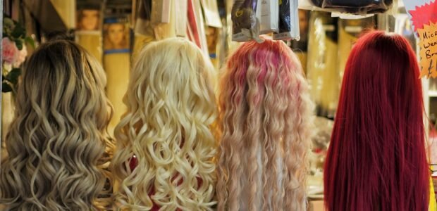 Measure your head for a wig – wigs displayed on stands