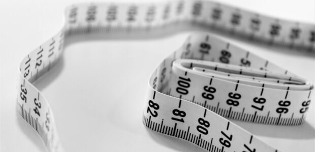 Measure yourself for a dress – tape measure close-up