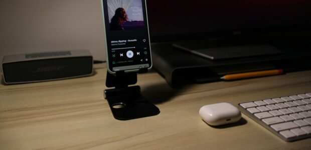 Phone propped up on a desk by a case kickstand