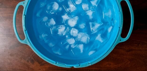 Ice bucket filled with ice cubes, illustrating a portable ice maker buying guide