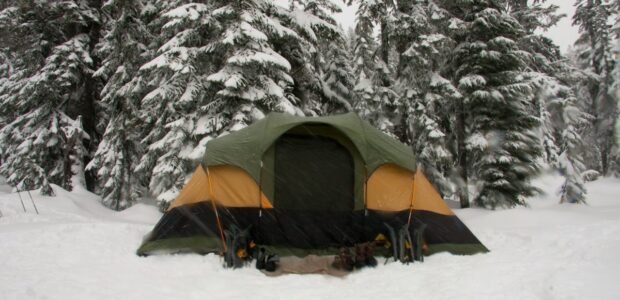 Portable power station in cold weather at a snowy winter campsite