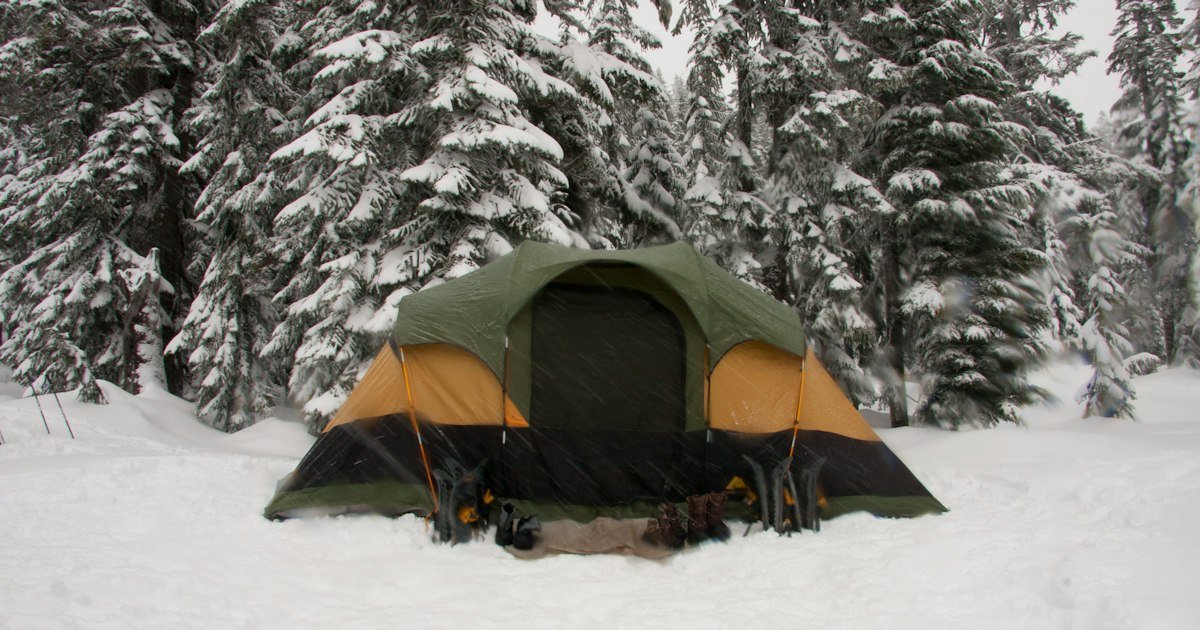Portable power station in cold weather at a snowy winter campsite