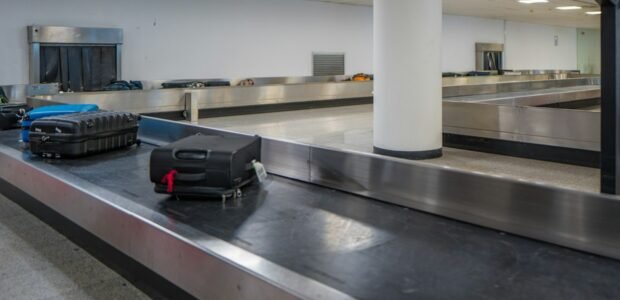 Luggage on a conveyor belt — why some travelers ship luggage ahead instead