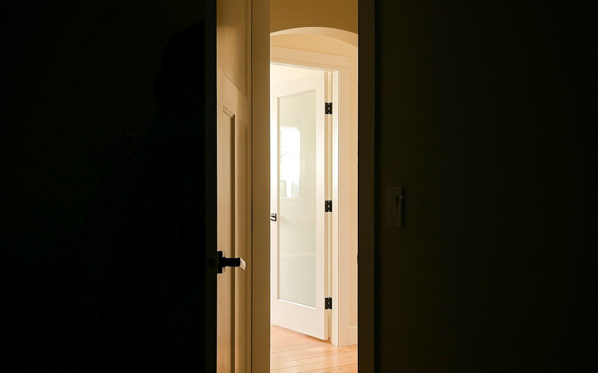 Sunlit open front door of a house, relevant to smart lock buying guide