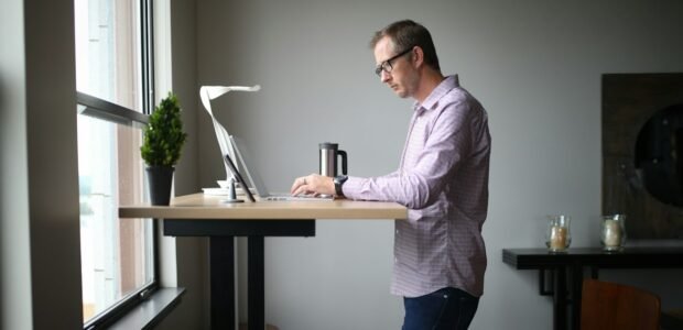 Standing desk height – man working at a standing desk