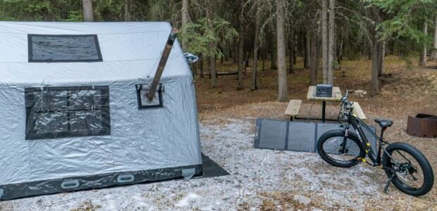 What size portable power station do I need – tent and solar panels at a campsite