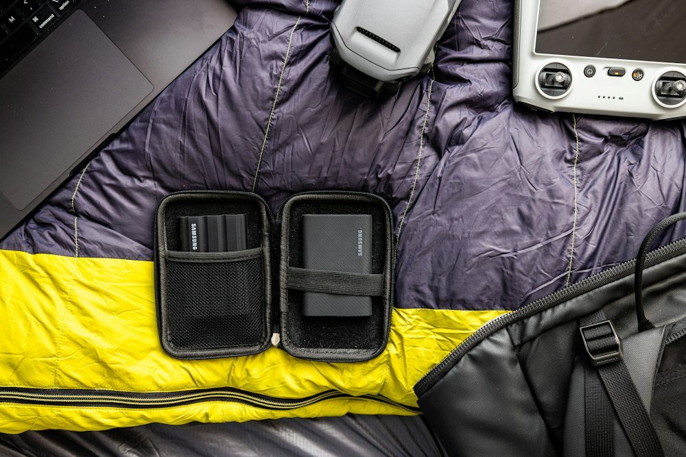 Camping gear and portable power bank laid out, the kind of setup an EcoFlow Black Friday power station deal is meant for