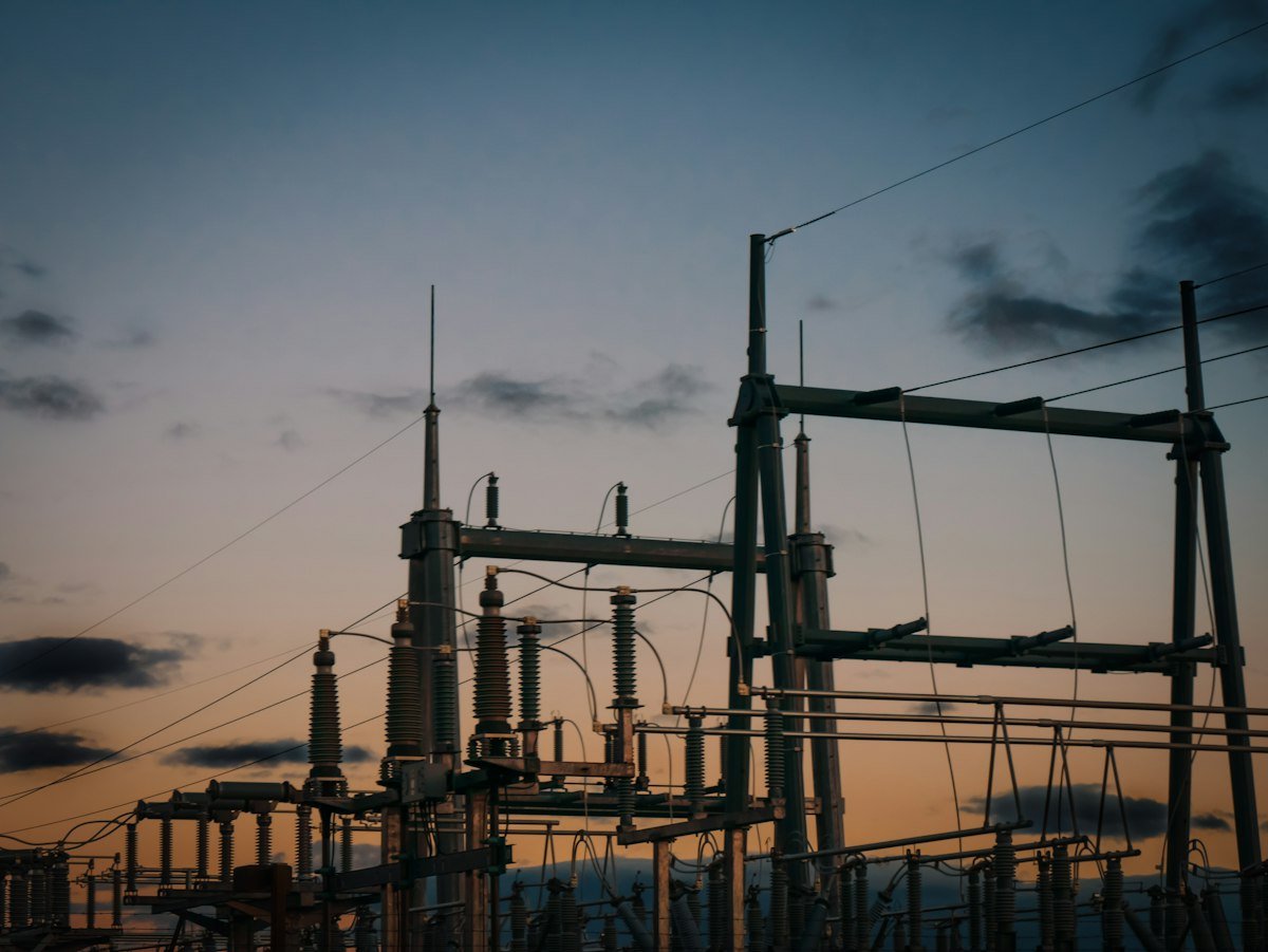a group of power lines against a sky background, representing grid power that an ALLPOWERS solar generator can back up during an outage